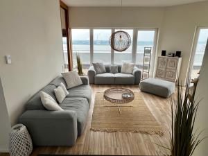 Posezení v ubytování COAST HOUSE Sky Suite