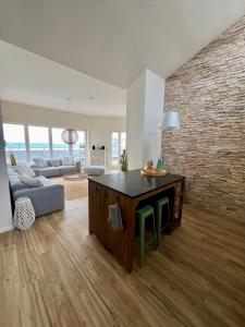 Posezení v ubytování COAST HOUSE Sky Suite