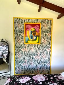 Ein Bett oder Betten in einem Zimmer der Unterkunft La Maison Créole du Flamboyant - Proche des Plages