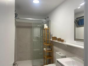 a bathroom with a shower and a toilet and a sink at El Rincón de Valentina 4B in Las Palmas de Gran Canaria