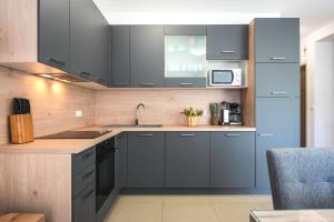 Kuchyň nebo kuchyňský kout v ubytování Apartment Klara