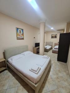 Postel nebo postele na pokoji v ubytování Hotel La Villa