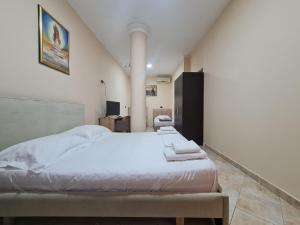 Postel nebo postele na pokoji v ubytování Hotel La Villa