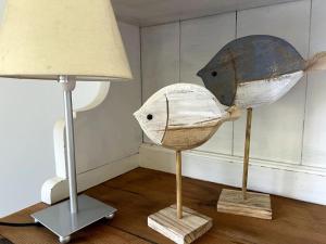 two hats on display next to a lamp at iL VICOLO NEL VERDE in Rio Marina