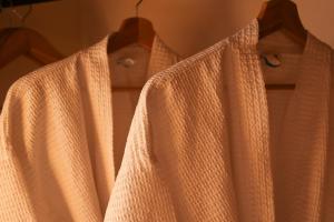 a close up of two shirts on a hanger at Mes&oacute;n De Leyendas Breakfast & Downtown in Valle de Bravo