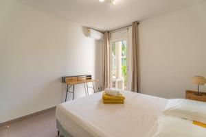 Letto o letti in una camera di Appartement Macaron Clair