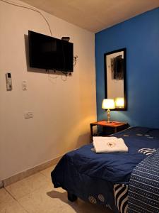 Postel nebo postele na pokoji v ubytování Hostel Shalom Adonai