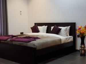 Postel nebo postele na pokoji v ubytování Taj Residence