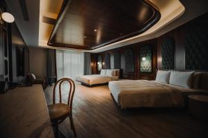 Posteľ alebo postele v izbe v ubytovaní XIUXI Anping Hotel