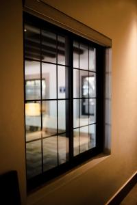 a window with a view of a street at Punto Madero Hotel & Plaza in Mocorito