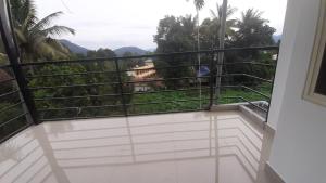 a balcony with a view of the mountains at Himadri munnar holidays in Munnar