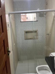 a bathroom with a shower and a toilet at Pousada RIOSTOUR in Barreirinhas +66 photos
