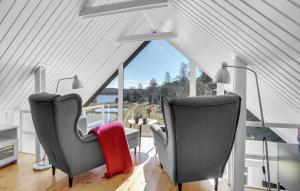 two chairs in a room with a large window at Awesome Home In Hobro With Kitchen in Hobro
