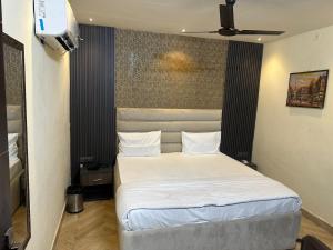 Postel nebo postele na pokoji v ubytování Hotel Kritika