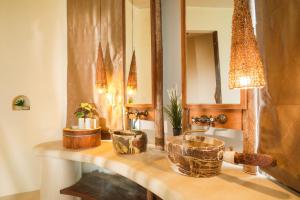 a bathroom counter with a sink and a mirror at Nangyuan Island Dive Resort in Ko Tao