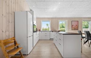 a kitchen with white cabinets and a white refrigerator at Beautiful Home In Hemmet With Wifi in Hemmet