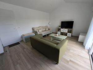 a living room with a couch and a table at Maison de campagne in Aubagne +3 photos