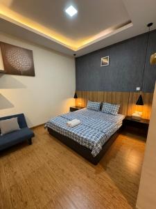 Ένα ή περισσότερα κρεβάτια σε δωμάτιο στο Monde Residence Block C Number 21, Batam Centre