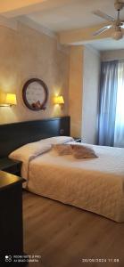 Postel nebo postele na pokoji v ubytování Hotel Borgo Antico
