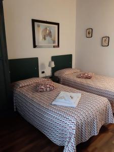 Postel nebo postele na pokoji v ubytování Hotel Borgo Antico