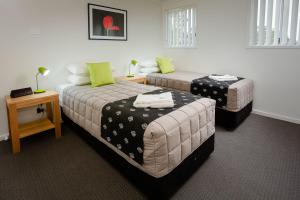 Giường trong phòng chung tại Wallsend Executive Apartments