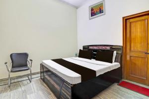 Krevet ili kreveti u jedinici u objektu SPOT ON Shri Ram Guest House