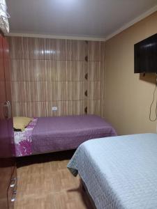 Krevet ili kreveti u jedinici u objektu Hostal MIRAMAR En Pleno Centro de Pozo Almonte