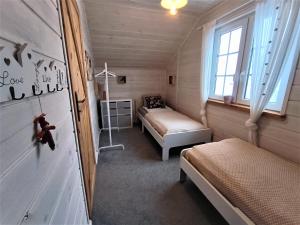 En eller flere senge i et værelse på GłuszaSpot Dom Freja