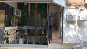 an open door to a building with a balcony at DB Apartment in Tirana
