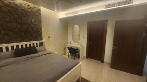 Ένα ή περισσότερα κρεβάτια σε δωμάτιο στο Amazing new apartment in the middle of Amman