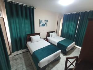 Postel nebo postele na pokoji v ubytování El Obayed Apartments Armed Forces + 22 fotografií