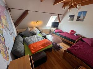 a living room with two beds and a couch at Ferienwohnung Segeln und Angeln in Grabowhöfe