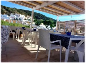 a table and chairs on a patio with a view at La casa dei 4 venti Affittacamere in Ponza