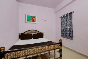 Posteľ alebo postele v izbe v ubytovaní SPOT ON Hotel Aaraadhya Residency