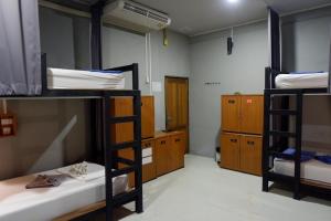 Postel nebo postele na pokoji v ubytování Leisure Hostel