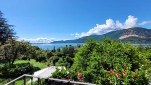 a view of a lake with mountains in the background at B&B La Lanterna in Verbania
