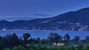 a view of a lake with mountains in the background at B&B La Lanterna in Verbania