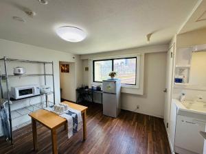 Una cocina o cocineta en 匯金北池袋ビル