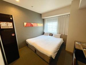 Postel nebo postele na pokoji v ubytování Henn na Hotel Tokyo Nishikasai