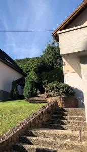 a set of stone steps leading to a house at Appartement Chez Maria in Guebwiller