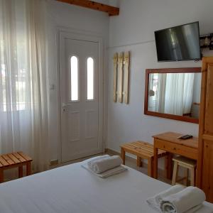 Postel nebo postele na pokoji v ubytování ANNA MARIA Studios