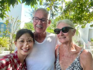 a man and two women posing for a picture at Moonbeam Homestay & Mini-resort Mui Ne in Phan Thiet