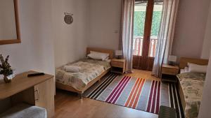 Krevet ili kreveti u jedinici u objektu Aparthotel Raikov Ski Lodge