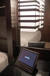 a laptop computer sitting on a table in a room at StripViewSuites at Vdara in Las Vegas