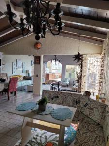 a living room with a couch and a table at Casa Grace en Playa Del Sol-15 in San Antonio del Mar +49 photos