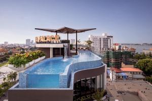 a swimming pool on top of a building at Chaiya Palace Hotel in Phnom Penh