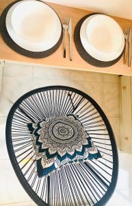 two plates on a wooden shelf with utensils at Skopelos Inn in Stafylos