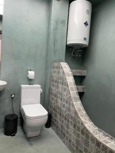 a bathroom with a toilet and a sink at Sea view Villa Sotiritsa in Velika +11 photos