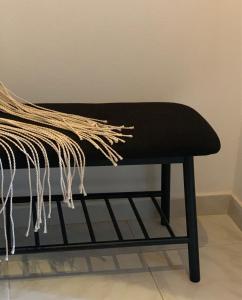 a black bench sitting in a room at Skopelos Inn in Stafylos