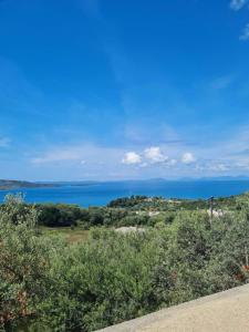 a view of the ocean from a hill at Karras Village in Plataria